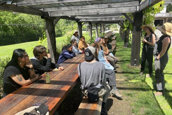 Students sitting at table in Green Valley Farm