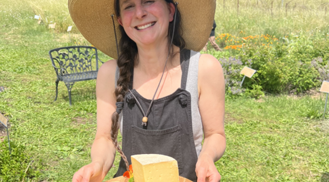 Caiti offering cheese at Green Valley Farm
