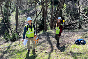 Two Students in Burned Landscape