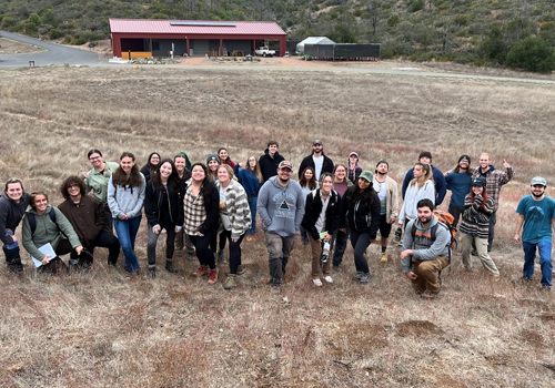 Group of students in the field during an applied ecology class
