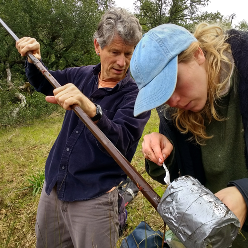 Dr. Baldwin helping a student analyze a sample