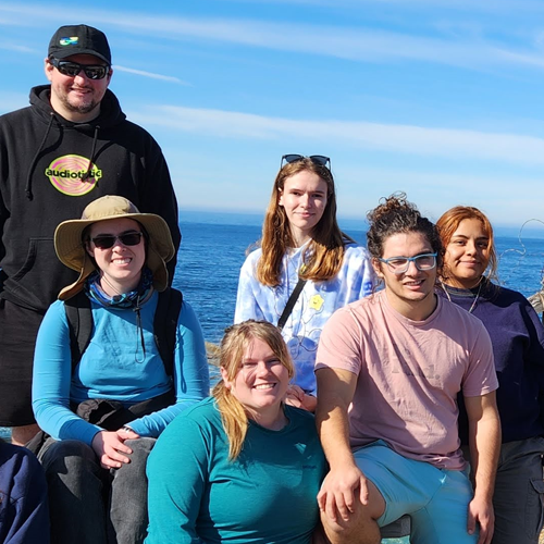 Group of 6 students at the ocean