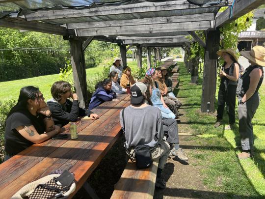 Students sitting at table in Green Valley Farm